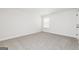 Bedroom features neutral carpet, trim, and walls with one window at 412 Cantrell Drive, Dallas, GA 30157