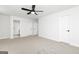 Spacious bedroom with neutral walls, carpet flooring, and ceiling fan at 412 Cantrell Drive, Dallas, GA 30157