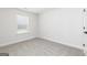 Bedroom features neutral carpet, trim, and walls with one window at 412 Cantrell Drive, Dallas, GA 30157