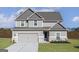 Charming two-story home featuring a two-car garage and a well-manicured lawn at 412 Cantrell Drive, Dallas, GA 30157