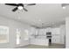 Open concept kitchen featuring an island, stainless steel appliances, and modern lighting fixtures at 412 Cantrell Drive, Dallas, GA 30157