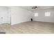 Spacious living room with vinyl flooring, plenty of natural light, and a ceiling fan at 412 Cantrell Drive, Dallas, GA 30157