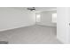 Spacious bedroom with a ceiling fan, light gray carpet, and light gray walls at 446 Cantrell Drive, Dallas, GA 30157