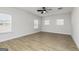 Spacious bedroom featuring wood-look flooring, natural light and a ceiling fan at 446 Cantrell Drive, Dallas, GA 30157