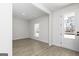 Bright living room featuring vinyl floors, natural light and a glass panel back door at 446 Cantrell Drive, Dallas, GA 30157