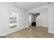 Inviting living room with stylish flooring, bright window and entry to the home's staircase at 446 Cantrell Drive, Dallas, GA 30157