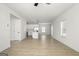 Open-concept living space featuring neutral walls, wood-look flooring, and access to a modern kitchen at 446 Cantrell Drive, Dallas, GA 30157