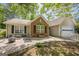 Charming home featuring a cozy patio with fire pit and seating, perfect for outdoor relaxation and entertaining at 5045 Edinborough Pl, Sugar Hill, GA 30518