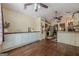 Spacious open kitchen with hardwood floors, white cabinets, stainless steel appliances, and an adjacent dining area at 5045 Edinborough Pl, Sugar Hill, GA 30518