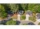 Aerial view of a neighborhood featuring three single Gathering homes with large wooded lots at 140 Braymoor Cir, Fayetteville, GA 30215