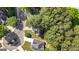 Aerial view of a neighborhood with wooded lots and beautiful landscaping at 140 Braymoor Cir, Fayetteville, GA 30215