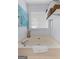 Relaxing bathroom with a soaking tub, window, and neutral color scheme at 140 Braymoor Cir, Fayetteville, GA 30215