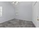 Neutral bedroom featuring plush carpeting, natural light, and a double-door closet at 140 Braymoor Cir, Fayetteville, GA 30215