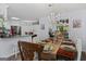 Lovely dining area with decorative chandelier, wooden table, and seating for elegant meals at 140 Braymoor Cir, Fayetteville, GA 30215