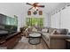 Inviting living room with a large window, cozy seating, and vaulted ceilings at 140 Braymoor Cir, Fayetteville, GA 30215