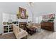 Inviting living room with fireplace, piano, and lots of natural light at 140 Braymoor Cir, Fayetteville, GA 30215