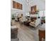 Spacious living room with vaulted ceilings, fireplace, and open dining area at 140 Braymoor Cir, Fayetteville, GA 30215