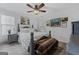 Bedroom featuring neutral paint, a ceiling fan, wood flooring, and lots of natural light at 140 Braymoor Cir, Fayetteville, GA 30215