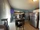 Bright dining space with a round table, leading into a kitchen with stainless steel appliances at 140 Se Mount Zion Rd # 41, Atlanta, GA 30354