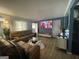Inviting living room featuring a large sectional sofa and a wall-mounted television at 140 Se Mount Zion Rd # 41, Atlanta, GA 30354