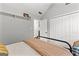 Neutral bedroom featuring vaulted ceiling, built-in shelving, and standard double-door closet at 75 Mcintosh Estates Dr, Sharpsburg, GA 30277