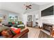 Spacious living area featuring vaulted ceilings, fireplace, and an open doorway to the bedroom at 75 Mcintosh Estates Dr, Sharpsburg, GA 30277