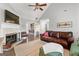 Inviting living room with vaulted ceilings, fireplace, and a view of the dining area at 75 Mcintosh Estates Dr, Sharpsburg, GA 30277