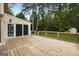 Back deck with adjacent screened porch offers ample outdoor living space with lush, private views at 100 Hartford Pl, Fayetteville, GA 30214