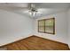 This bright bedroom is complete with hardwood floors, a ceiling fan and natural lighting at 100 Hartford Pl, Fayetteville, GA 30214