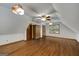 Large bonus room with hardwood floors, multiple closets, ceiling fans and natural light at 100 Hartford Pl, Fayetteville, GA 30214