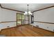 Elegant dining room featuring hardwood floors, traditional trim, and chandelier at 100 Hartford Pl, Fayetteville, GA 30214