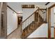 Traditional foyer featuring wooden staircase and trim, and tile flooring at 100 Hartford Pl, Fayetteville, GA 30214