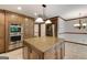 Open kitchen features wood cabinets, granite countertops, and stainless steel appliances at 100 Hartford Pl, Fayetteville, GA 30214