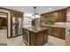 Open kitchen features wood cabinets, granite countertops, and stainless steel appliances at 100 Hartford Pl, Fayetteville, GA 30214
