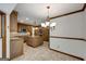 Open kitchen view showing adjacent dining area with white walls and wood trim at 100 Hartford Pl, Fayetteville, GA 30214
