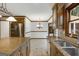 Open kitchen view showing adjacent dining area with white walls and wood trim at 100 Hartford Pl, Fayetteville, GA 30214