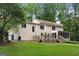 Exterior of home featuring a large back deck, screened porch, and expansive yard at 100 Hartford Pl, Fayetteville, GA 30214