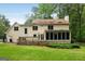 Exterior of home featuring back deck, screened porch, and a spacious, level backyard at 100 Hartford Pl, Fayetteville, GA 30214
