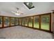 Bright sunroom with expansive windows offering views of the surrounding yard and a skylight at 100 Hartford Pl, Fayetteville, GA 30214