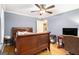 Bedroom with a ceiling fan, and wood floors, offering comfort and classic style at 165 White Rose Ln, Temple, GA 30179