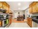 Spacious kitchen with stainless steel appliances and wooden cabinets that offers ample storage at 165 White Rose Ln, Temple, GA 30179