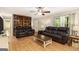 Spacious living room featuring hardwood floors, comfortable seating, and a view to the entrance at 165 White Rose Ln, Temple, GA 30179