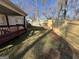 Spacious backyard featuring a wooden fence and a small deck at 3875 Grand Prix St, Cumming, GA 30041