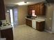 View of the kitchen featuring white appliances and tile flooring at 3875 Grand Prix St, Cumming, GA 30041