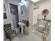 Well-maintained bathroom featuring a pedestal sink, toilet, and shower-tub combination at 80 Jacksons Vly, Sharpsburg, GA 30277