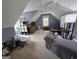 Attic bedroom with sloped ceilings and carpet, includes a window for natural light at 80 Jacksons Vly, Sharpsburg, GA 30277