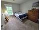 Cozy bedroom with natural light, window and rustic wooden dresser at 80 Jacksons Vly, Sharpsburg, GA 30277