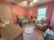 Bedroom bedroom includes a crib, gray dresser and chair, and a window for natural light at 80 Jacksons Vly, Sharpsburg, GA 30277
