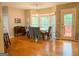 Bright dining room with large windows, a dining table, and hardwood floors at 80 Jacksons Vly, Sharpsburg, GA 30277