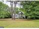 Traditional two-story home with a well-manicured lawn and mature trees at 80 Jacksons Vly, Sharpsburg, GA 30277